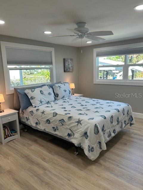 6837 Flicker Lane Hudson, FL 34667 - Photo 12 of 28 a bedroom with a bed and window