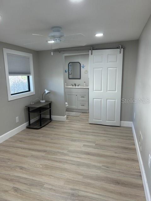 6837 Flicker Lane Hudson, FL 34667 - Photo 15 of 28 a view of a room with wooden floor and cabinet