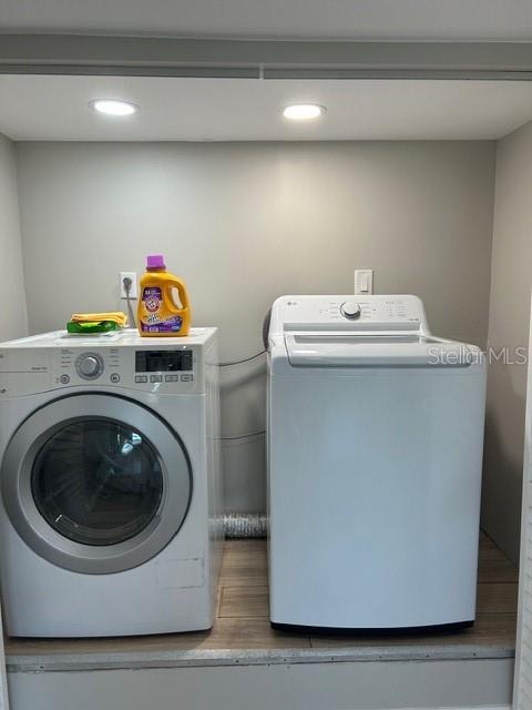 6837 Flicker Lane Hudson, FL 34667 - Photo 19 of 28 a utility room with dryer and washer