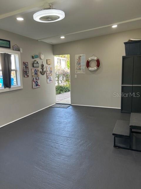 6837 Flicker Lane Hudson, FL 34667 - Photo 22 of 28 a view of a livingroom with wooden floor and a large window