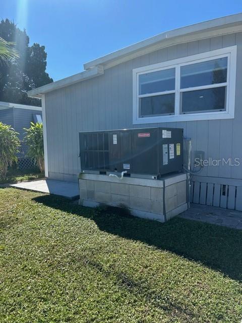 6837 Flicker Lane Hudson, FL 34667 - Photo 24 of 28 a front view of a house with garden
