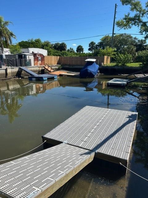6837 Flicker Lane Hudson, FL 34667 - Photo 28 of 28 a roof deck with table and chairs
