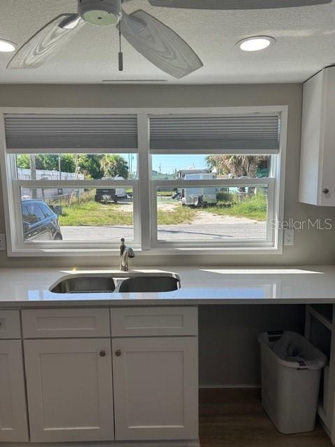 6837 Flicker Lane Hudson, FL 34667 - Photo 6 of 28 a kitchen with a window a sink and a counter space