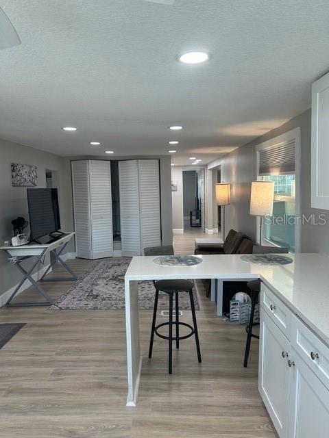 6837 Flicker Lane Hudson, FL 34667 - Photo 7 of 28 a large kitchen with a table and chairs in it