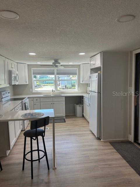 6837 Flicker Lane Hudson, FL 34667 - Photo 8 of 28 a kitchen with stainless steel appliances granite countertop a sink stove and refrigerator