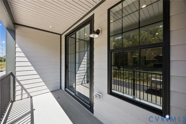 a view of a balcony with wooden floor