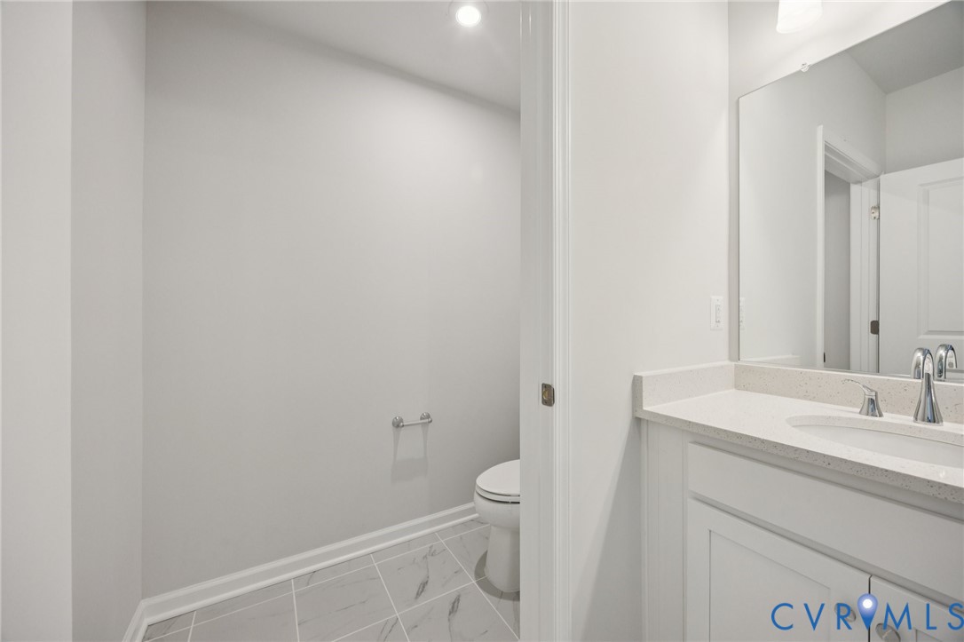 13239 Garland Lane Midlothian, VA 23114 - Photo 17 of 48 a bathroom with a sink a toilet and a mirror