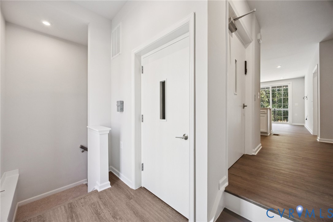 13239 Garland Lane Midlothian, VA 23114 - Photo 24 of 48 a view of a hallway with wooden floor and closet area