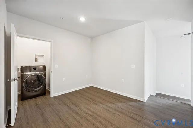 a view of a storage & utility room with wooden floor
