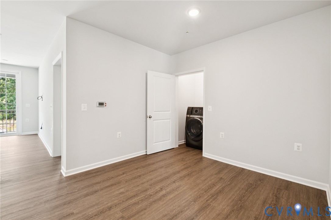 13239 Garland Lane Midlothian, VA 23114 - Photo 29 of 48 a view of an empty room with wooden floor and a window