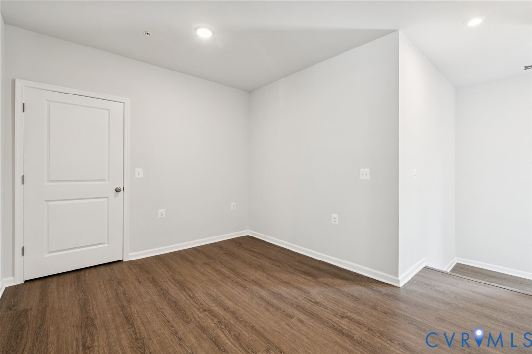 13239 Garland Lane Midlothian, VA 23114 - Photo 30 of 48 a view of an empty room with wooden floor