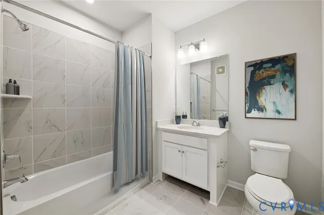 a bathroom with a toilet a sink and a bathtub