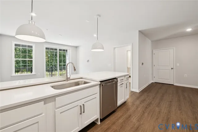 a kitchen that has a sink and a stove