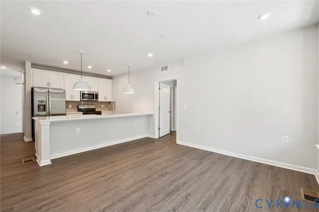 a view of kitchen with wooden floor