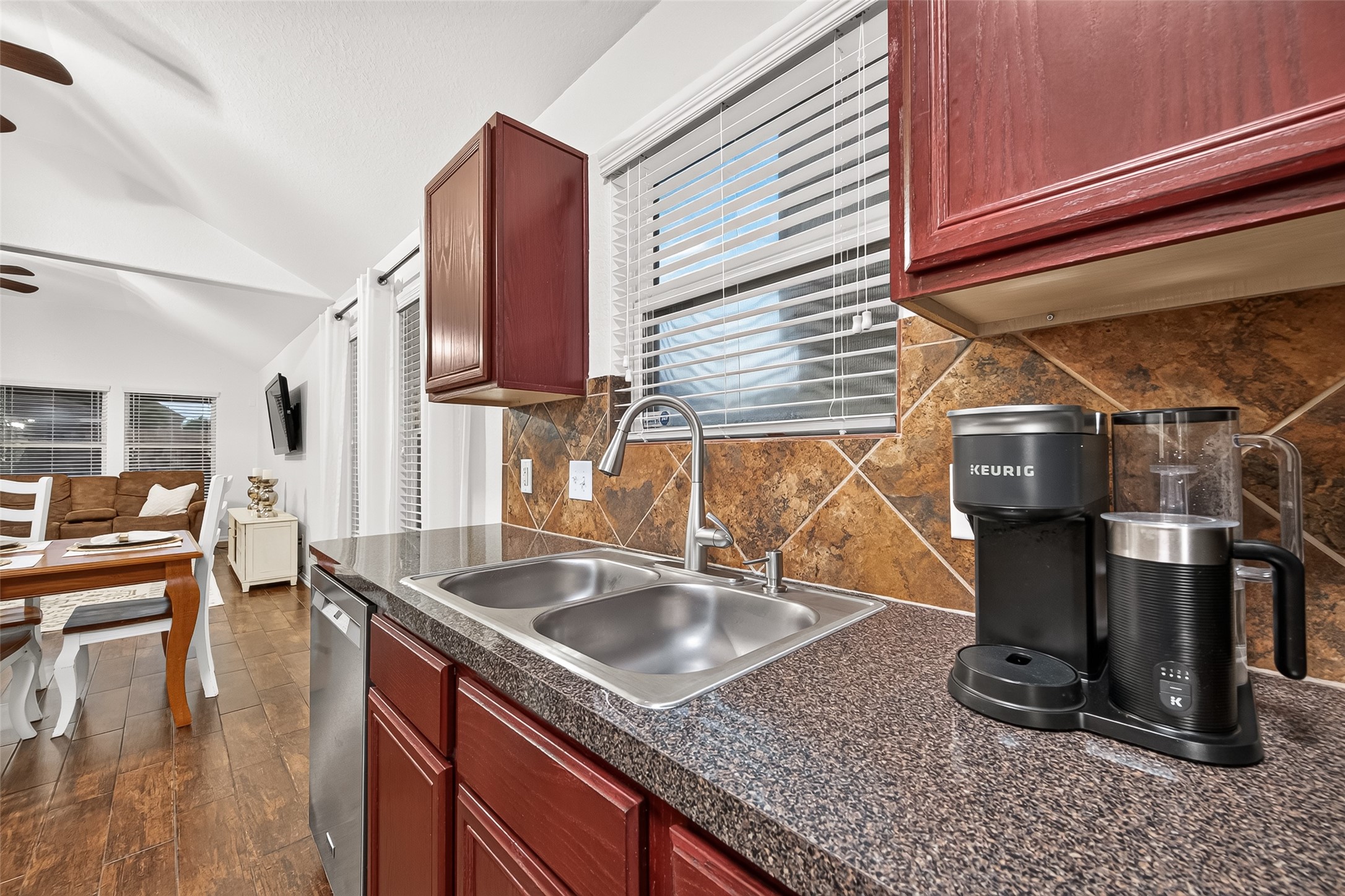 3155 View Valley Trail Katy, TX 77493 - Photo 23 of 50 Functional sink area with a window view, offering ample workspace and elegant finishes.