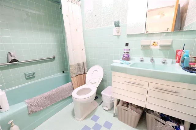 a bathroom with a sink toilet and a bathtub