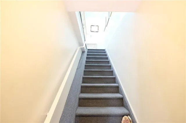 a view of entryway with wooden floor