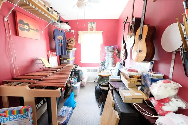a bedroom with a bed dresser and a window