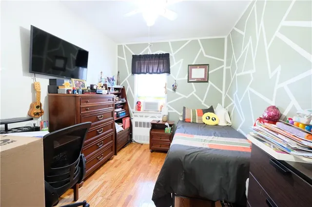 a kitchen with stainless steel appliances granite countertop a refrigerator a stove top oven a chimney cabinets and dining table