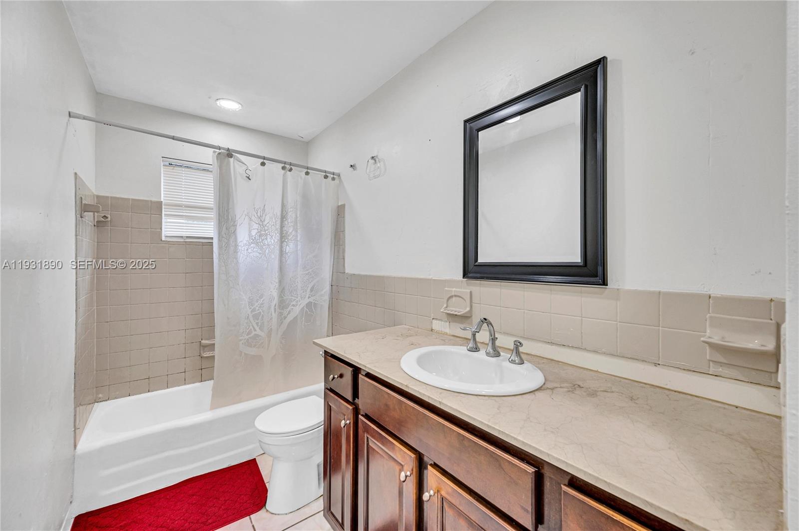 4751 Northwest 5th Court Plantation, FL 33317 - Photo 22 of 34 a bathroom with a granite countertop sink toilet and shower