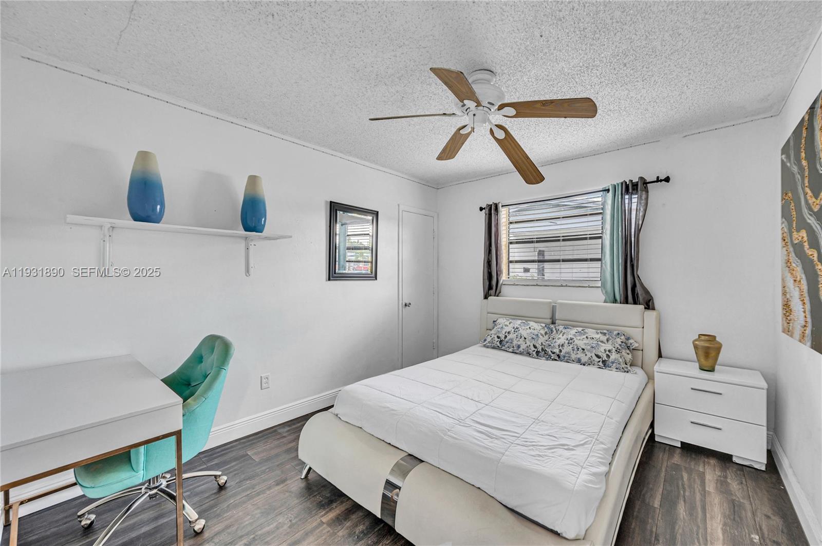 4751 Northwest 5th Court Plantation, FL 33317 - Photo 23 of 34 a bedroom with a bed and a desk