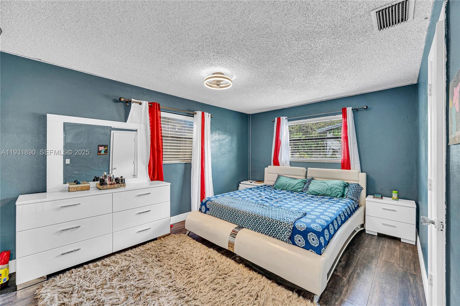 4751 Northwest 5th Court Plantation, FL 33317 - Photo 25 of 34 a bedroom with a bed and window