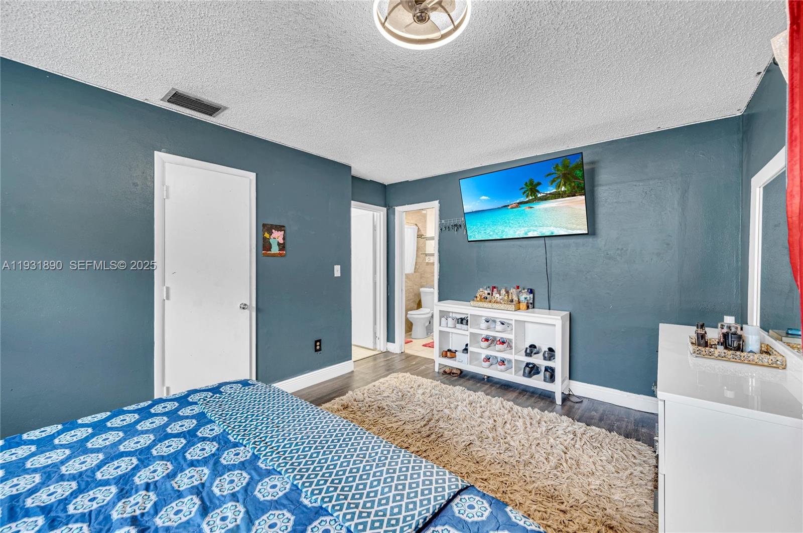 4751 Northwest 5th Court Plantation, FL 33317 - Photo 27 of 34 a bedroom with a bed and a table in it