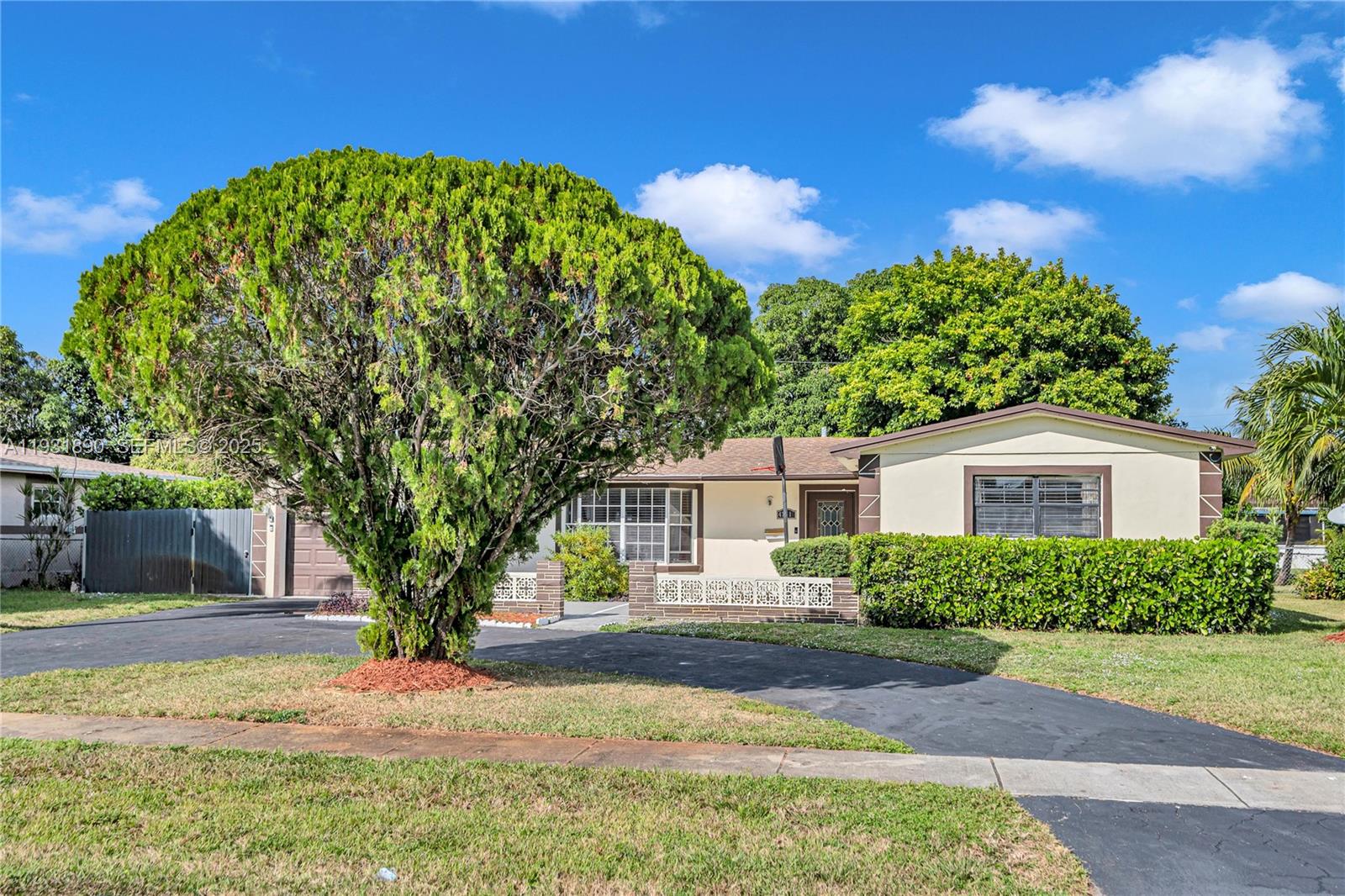 4751 Northwest 5th Court Plantation, FL 33317 - Photo 3 of 34 front view of a house with a yard
