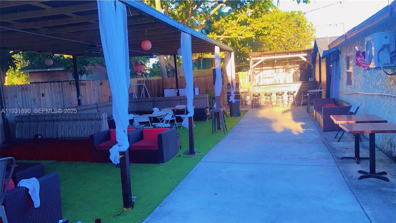 4751 Northwest 5th Court Plantation, FL 33317 - Photo 34 of 34 a view of a house with backyard water fountain and sitting area