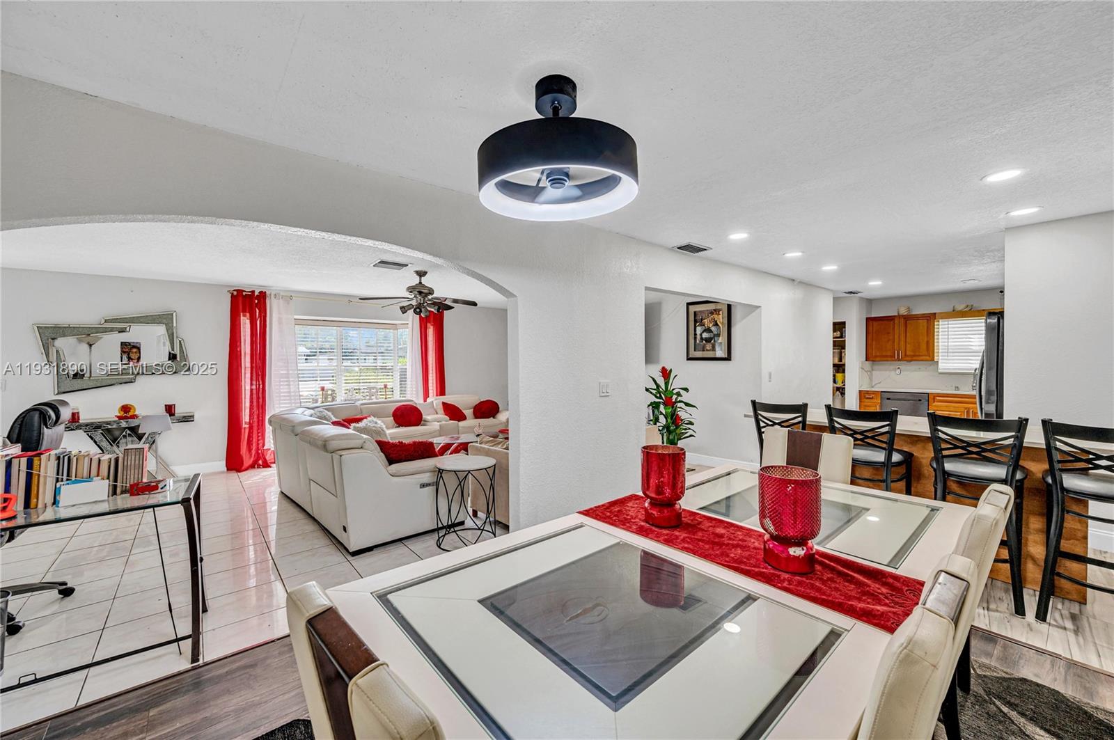 4751 Northwest 5th Court Plantation, FL 33317 - Photo 7 of 34 a living room with furniture and a flat screen tv