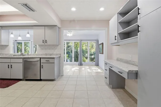 a kitchen with a stove sink and a microwave