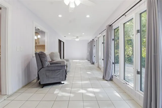 a view of a hallway with closet and bathroom
