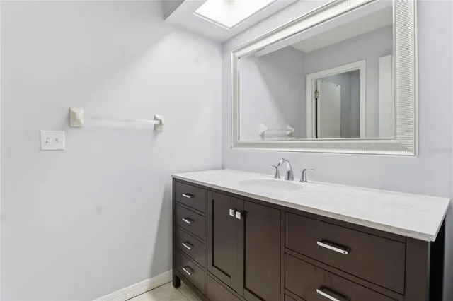 a white toilet sitting next to a bath tub