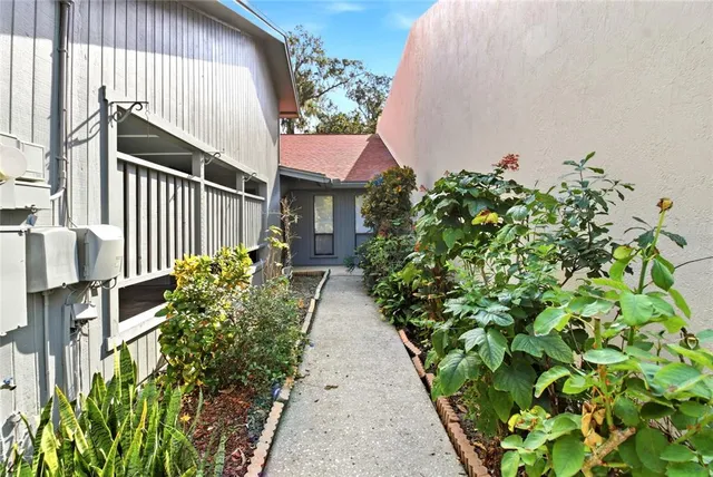 a view of a pathway in front of house