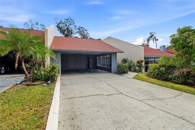 an aerial view of a houses with yard