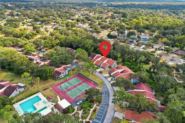 an aerial view of residential house with outdoor space and swimming pool