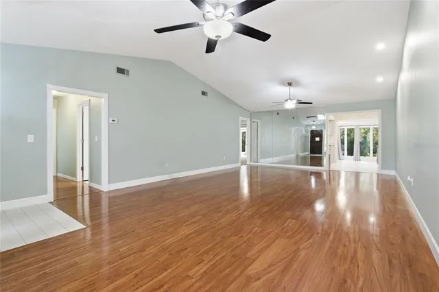 a kitchen with stainless steel appliances granite countertop a refrigerator a stove a microwave oven a sink with island and chairs