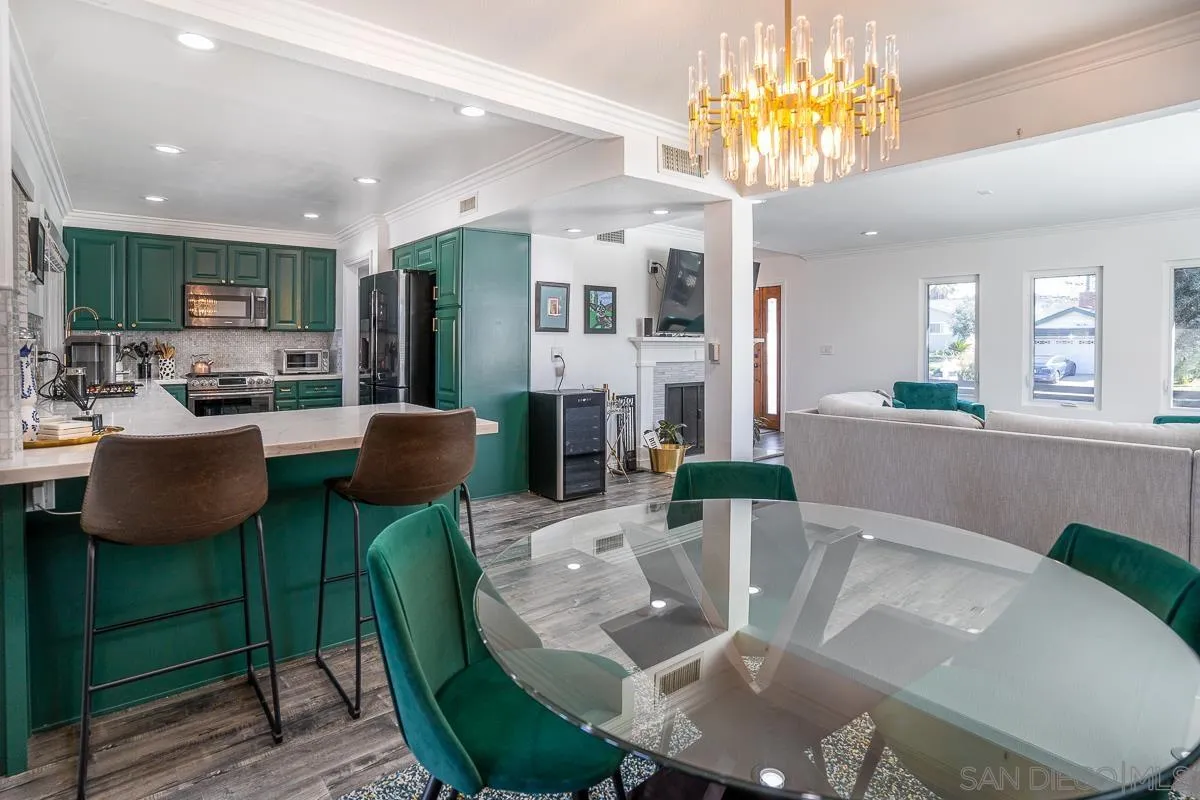 23615 Decorah Road Diamond Bar, CA 91765 - Photo 12 of 42 a living room with stainless steel appliances furniture a dining table and a chandelier