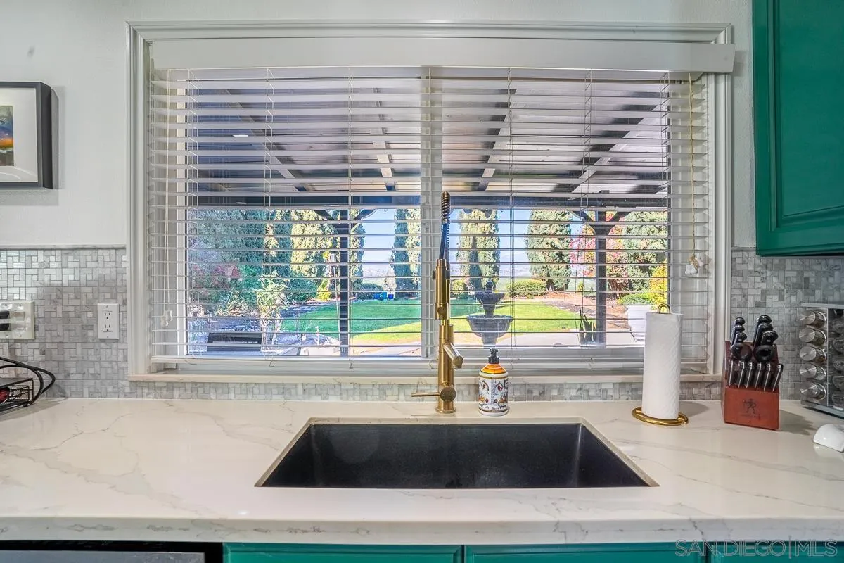 23615 Decorah Road Diamond Bar, CA 91765 - Photo 16 of 42 a kitchen with a sink and large window