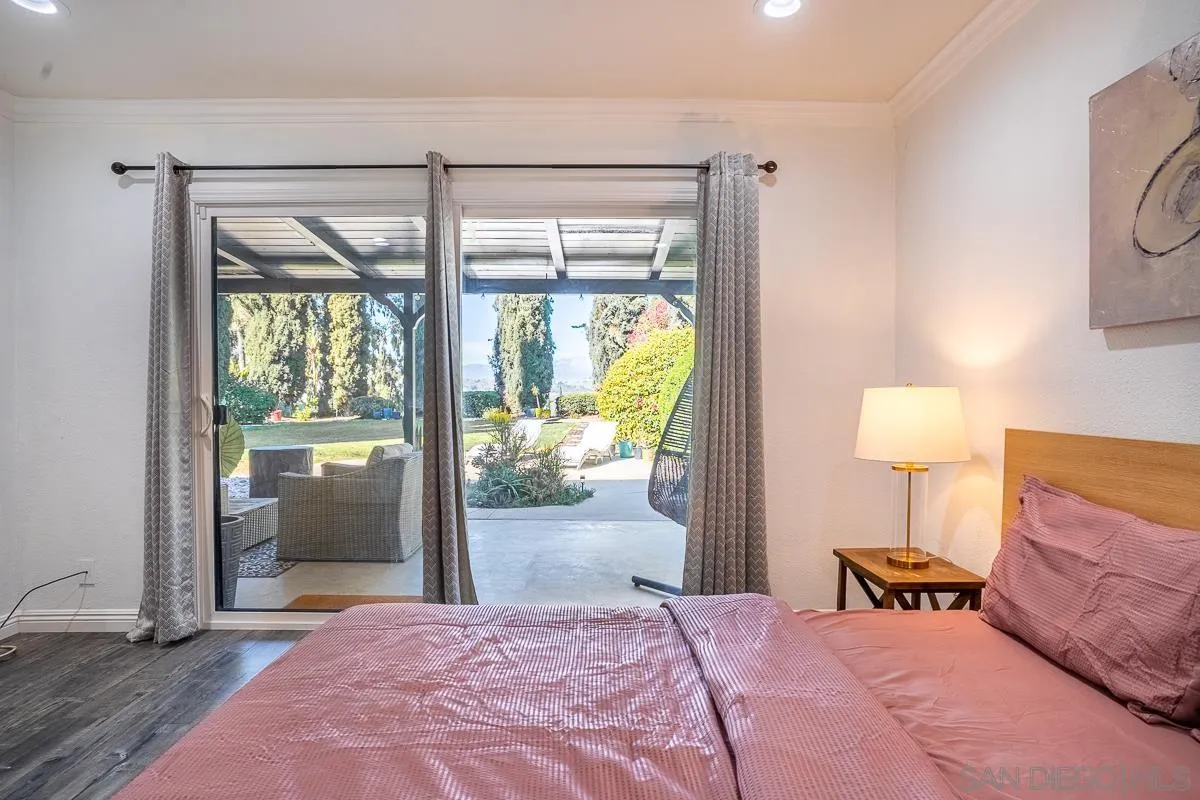 23615 Decorah Road Diamond Bar, CA 91765 - Photo 19 of 42 a bedroom with a bed and a lamp