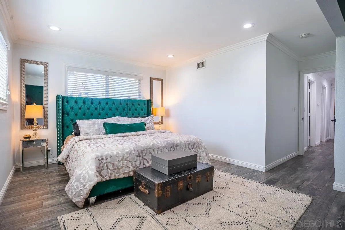 23615 Decorah Road Diamond Bar, CA 91765 - Photo 25 of 42 a bedroom with a large bed a rug and a window
