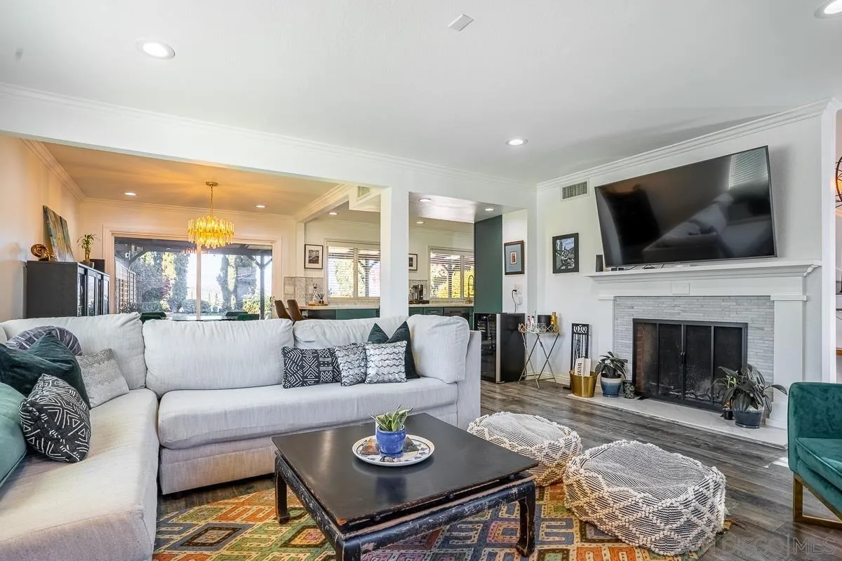 23615 Decorah Road Diamond Bar, CA 91765 - Photo 8 of 42 a living room with furniture a fireplace and a flat screen tv
