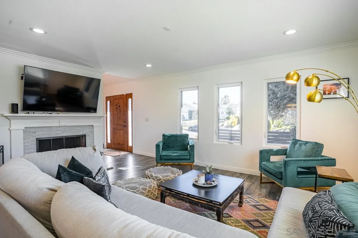 23615 Decorah Road Diamond Bar, CA 91765 - Photo 9 of 42 a living room with furniture a fireplace and a flat screen tv