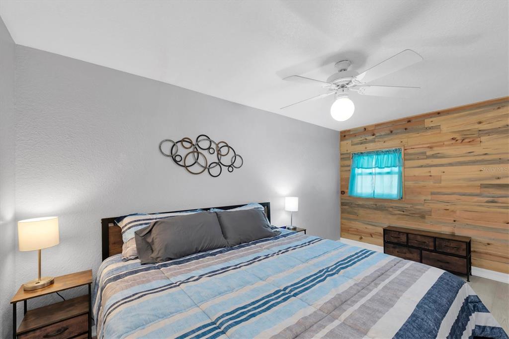 819 10th Street Southwest Largo, FL 33770 - Photo 14 of 85 a bedroom with a bed and a chandelier