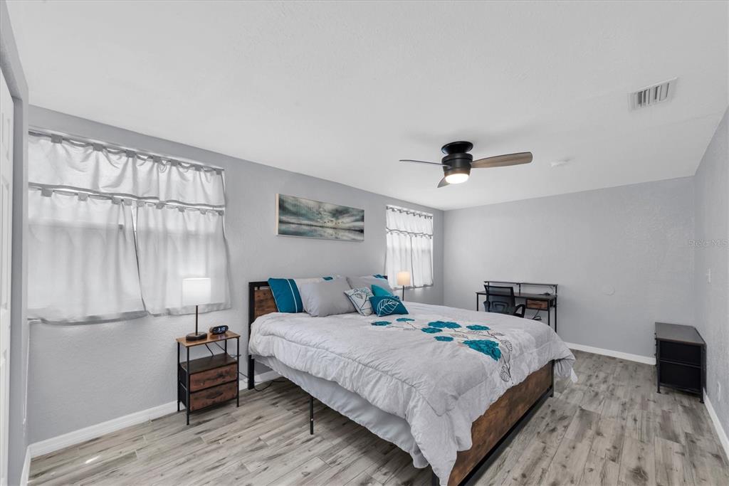 819 10th Street Southwest Largo, FL 33770 - Photo 15 of 85 a bedroom with a bed and a table