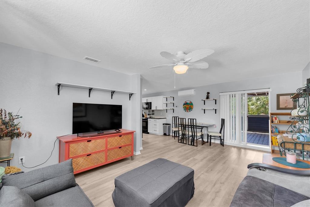 819 10th Street Southwest Largo, FL 33770 - Photo 30 of 85 a living room with furniture and a flat screen tv