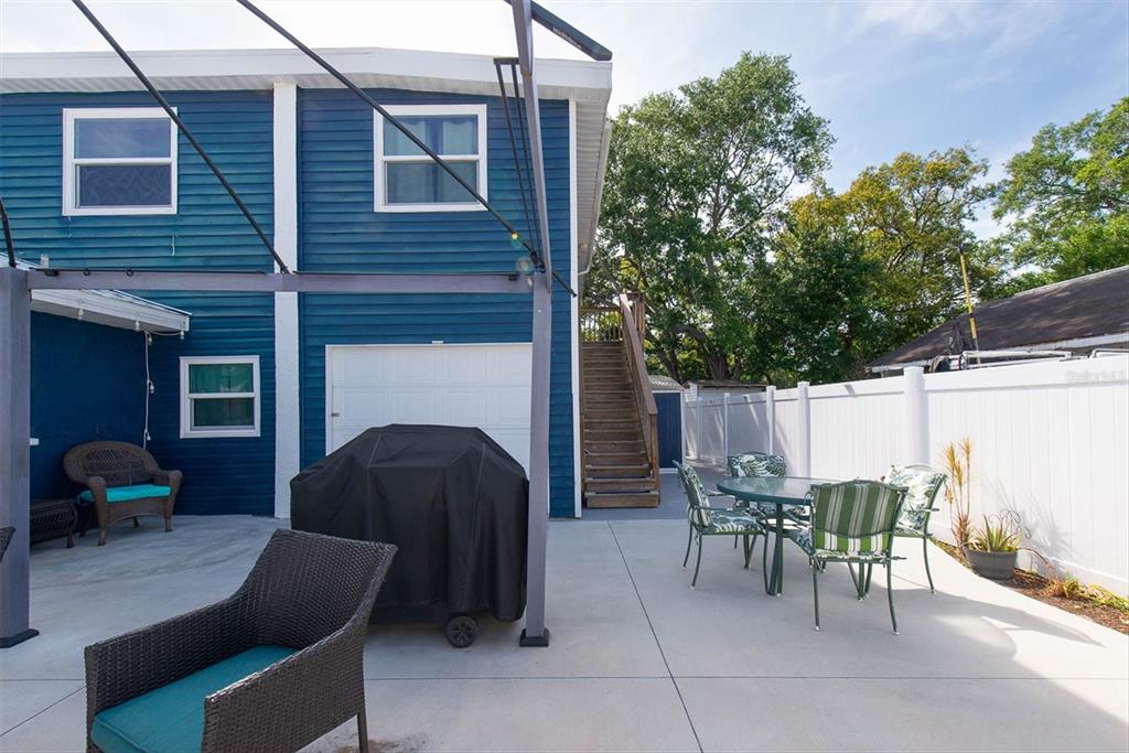 819 10th Street Southwest Largo, FL 33770 - Photo 77 of 85 a patio with table and chairs and potted plants