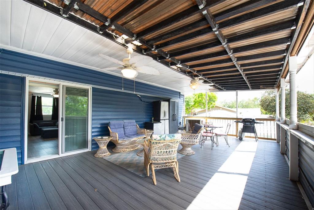 819 10th Street Southwest Largo, FL 33770 - Photo 82 of 85 a view of a deck with wooden floor and outdoor seating