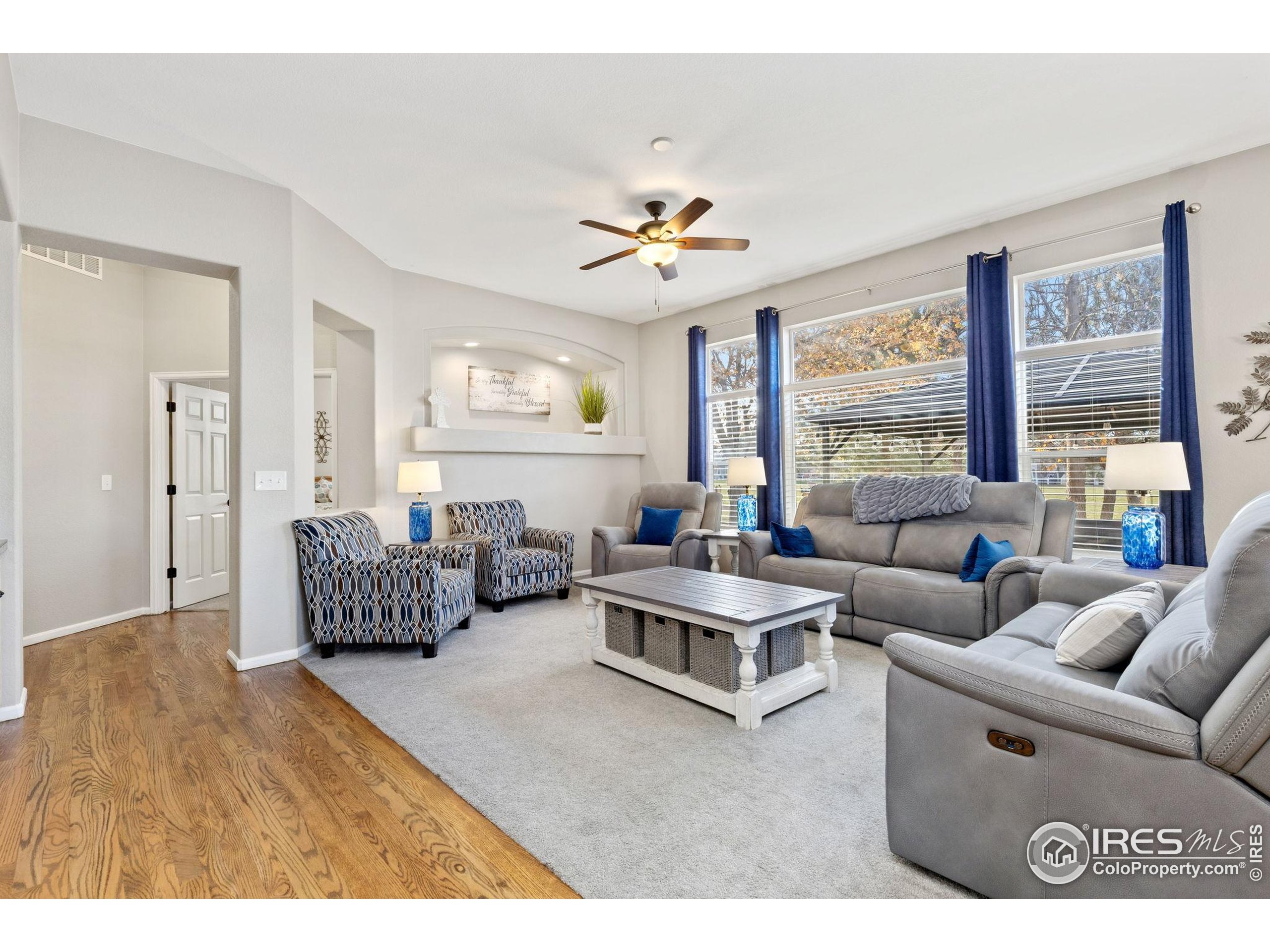 10166 Scenic Court Firestone, CO 80504 - Photo 12 of 33 a living room with furniture and a large window