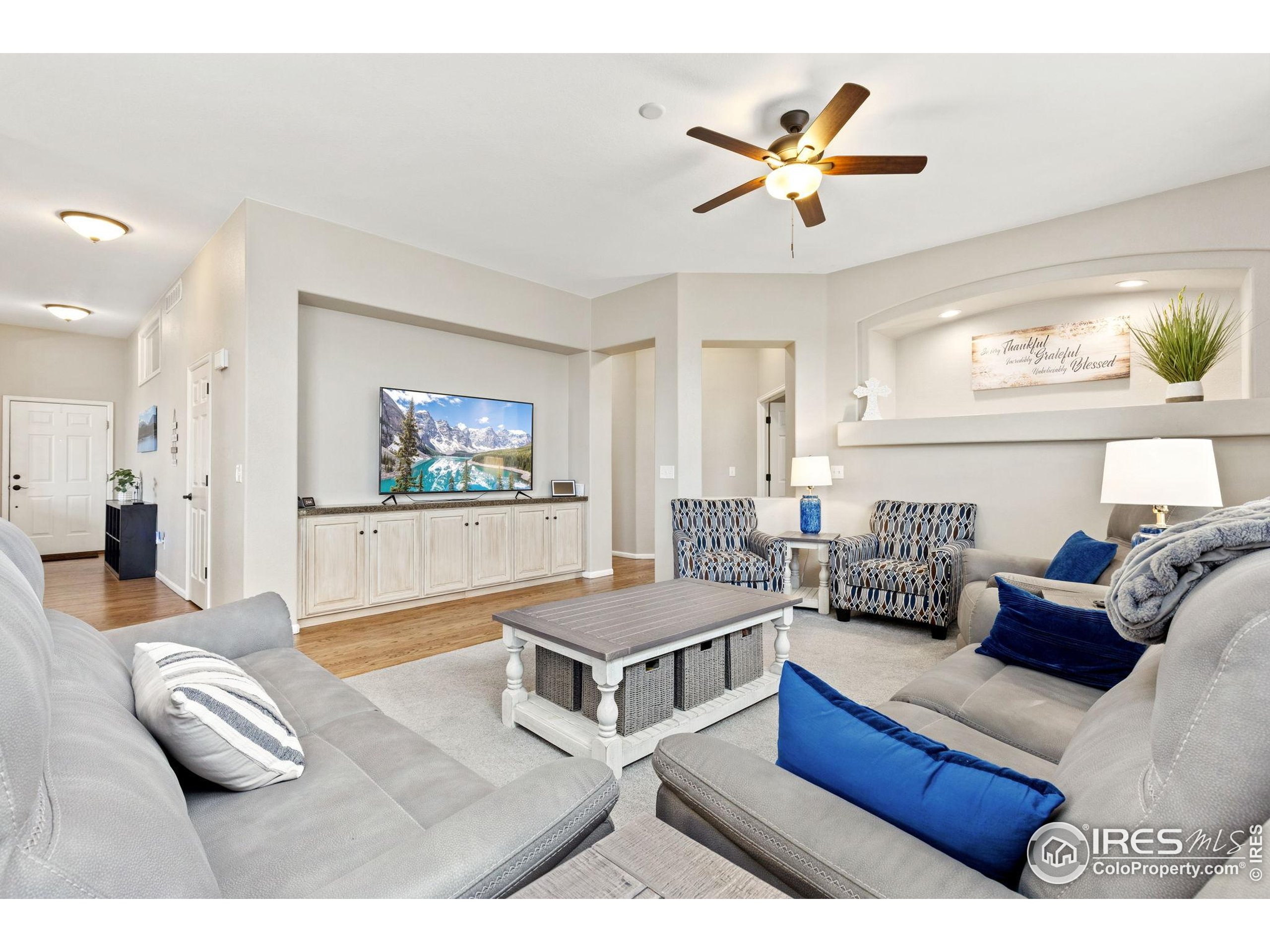 10166 Scenic Court Firestone, CO 80504 - Photo 13 of 33 a living room with furniture and a flat screen tv